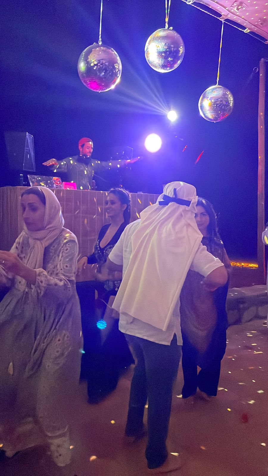 Dancers under disco balls at Migrino